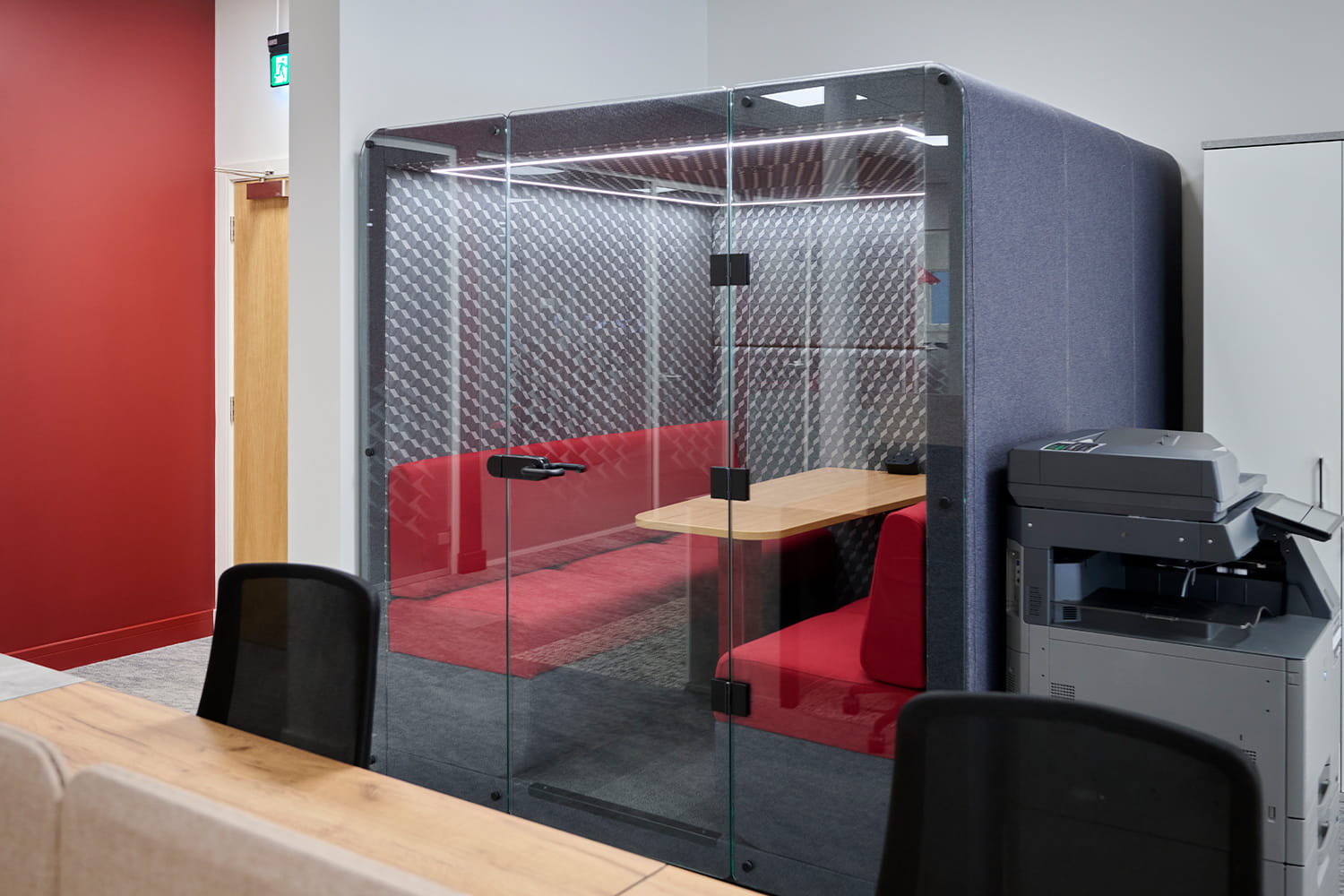 Free standing acoustic meeting booth within DiversiTech International’s agile office workspace