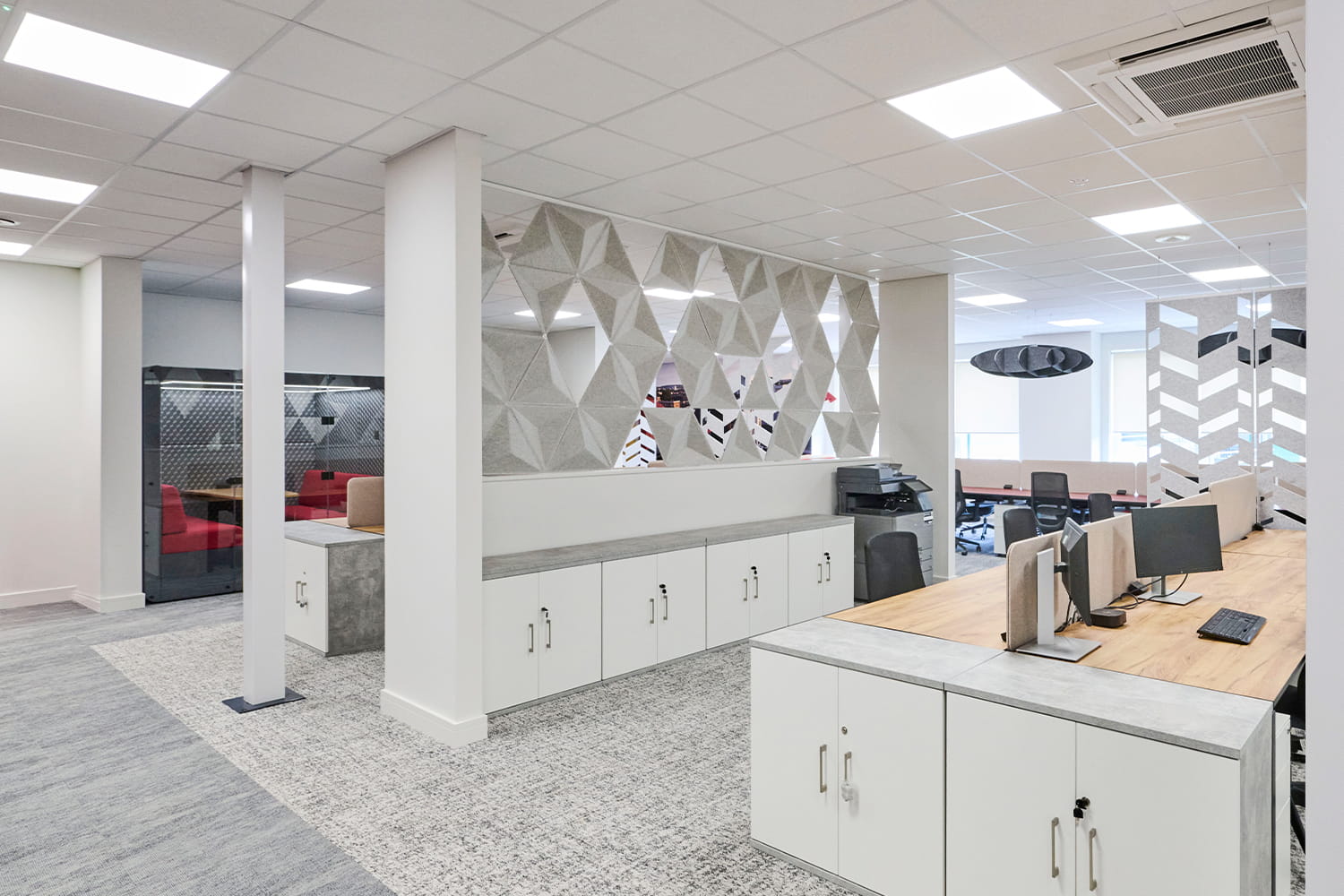 Office desks with acoustic pendant features at DiversiTech International’s Nottingham workplace