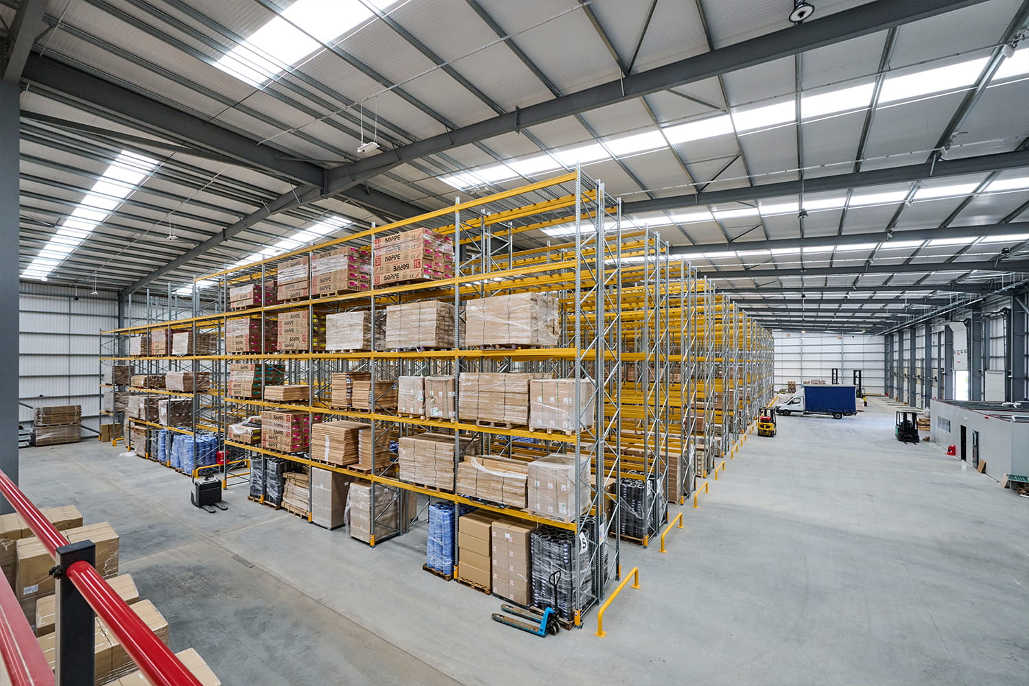 Warehouse racking installation with safety barriers at DiversiTech International’s Nottingham headquarters