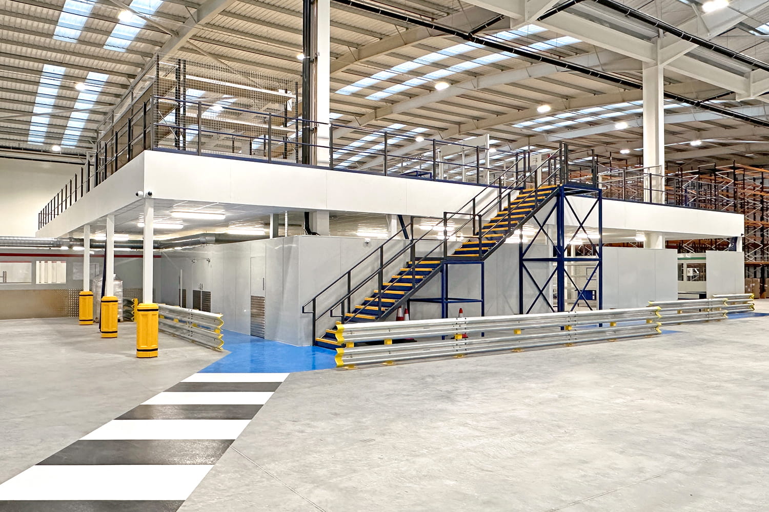 warehouse mezzanine floor installation with epoxy footpath